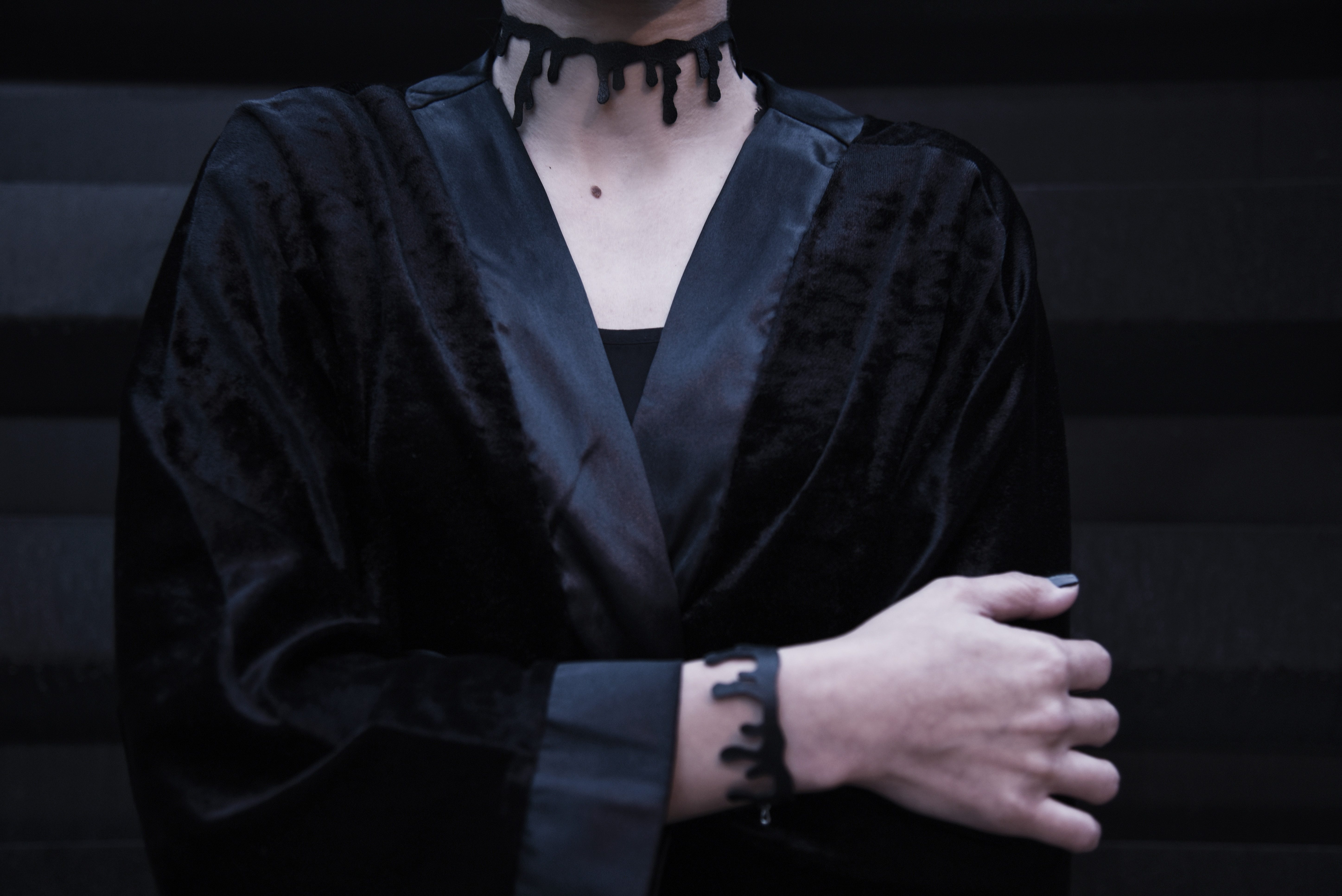 Velvet dress, Black velvet dress of women with mole on neck and she wears a neck band
